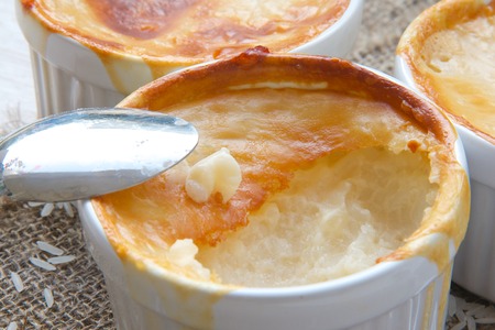 Rice pudding in white ceramic moulds. Close upの写真素材