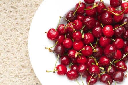 Sweet cherries in the whiye plate.Closeupの写真素材