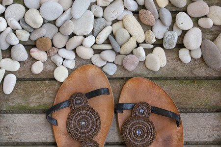 Leather summer womens shoes on an old wooden surface. Background ...