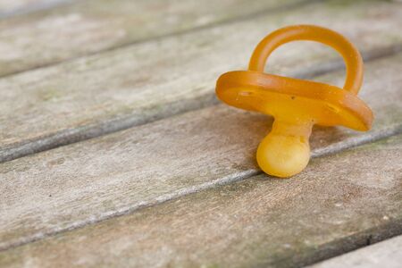Dirty rubber pacifier lost by someone. Closeupの写真素材