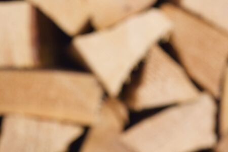 Wooden pieces for a fire place. Background. Out of focus.の写真素材