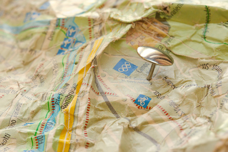 Silver like office pin on a jammed map. Closeup  indicationの写真素材