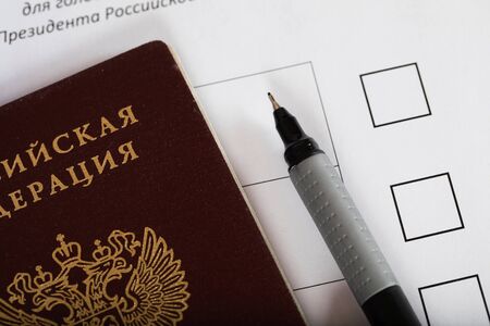 Russian passport on a approximate sample of ballot paper for presidential elections. Translation - Russian Federation. And on the paper - ballot paper for presidential elections in Russia.  Closeupの写真素材