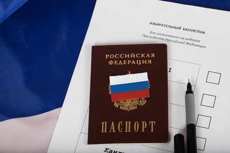Russian passport on a ballot paper for presidential elections. Translation on the paper - ballot paper for presidential election in Russia, on the pass - Russian Federation. Passport.の写真素材