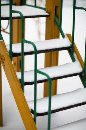 Stairs covered by snow at playground.Closeupの写真素材
