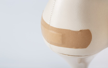 Adhesive bandage attached to summer high heels. Closeupの写真素材