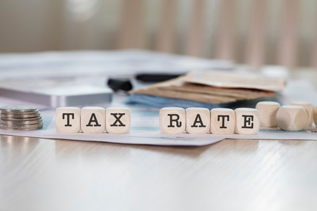 Word TAX RATE composed of wooden letters. Closeupの写真素材