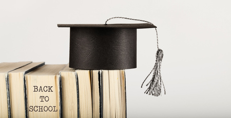Academic hat on books. Free space for a text. Closeupの写真素材