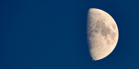 Photograph of the moon with visible cratersの写真素材