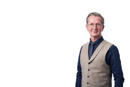 Smiling businessman portrait. Successful business man wearing light suit.の写真素材