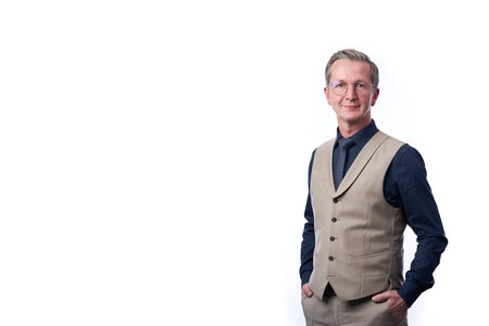 Smiling businessman portrait. Successful business man wearing light suit.の写真素材