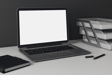 Side view and close up of empty laptop screen on office desk. Web design concept. Mock up, 3D Rendering の写真素材