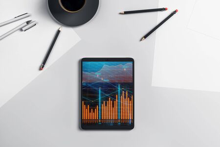 Digital tablet closeup top view with financial graph on screen. Online trading application concept. 3d rendering.の写真素材