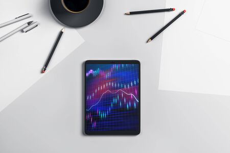Digital tablet closeup top view with financial graph on screen. Online trading application concept. 3d rendering.の写真素材