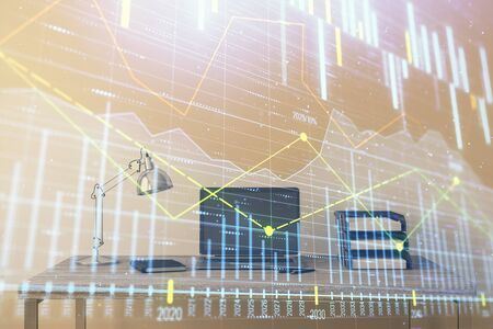 Stock market chart and desktop office computer background. Multi exposure. Concept of financial analysis.の写真素材