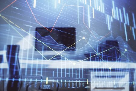 Stock market chart and desktop office computer background. Multi exposure. Concept of financial analysis.の写真素材