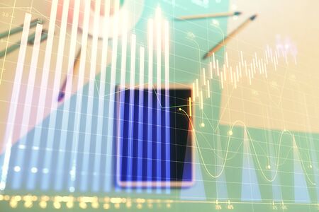 Double exposure of forex graph on digital tablet laying on table background. Concept of market analysisの写真素材