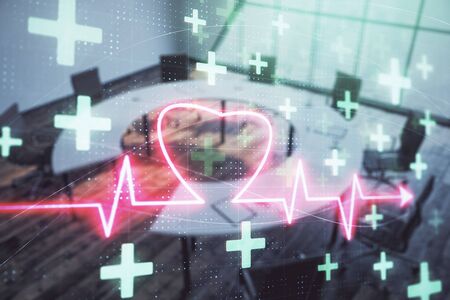 Double exposure of heart hologram on conference room background. Concept of medical educationの写真素材