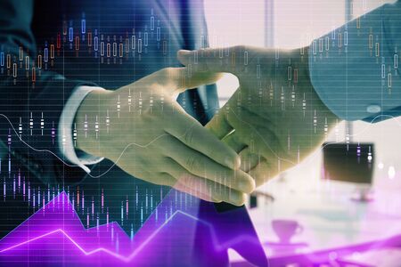 Multi exposure of financial graph on office background with two businessmen handshake. Concept of success in businessの写真素材