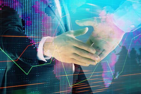 Multi exposure of forex graph and world map on abstract background with two businessmen handshake. Concept of success on international marketsの写真素材