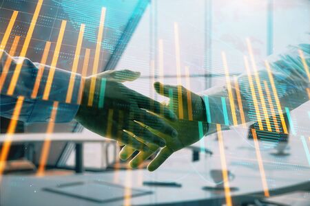 Multi exposure of financial chart and map on office background with two businessmen handshake. Concept of success in businessの写真素材
