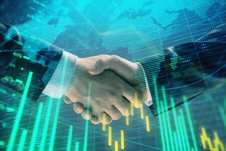 Multi exposure of forex graph and world map on abstract background with two businessmen handshake. Concept of success on international marketsの写真素材