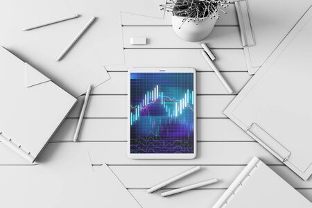 Digital tablet closeup top view with financial graph on screen. Online trading application concept. 3d rendering.の写真素材