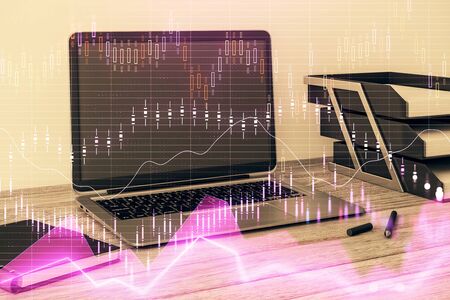 Stock market chart and desktop office computer background. Multi exposure. Concept of financial analysis.の写真素材