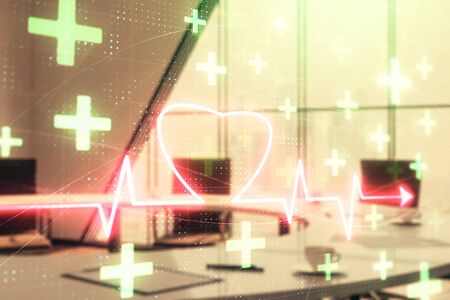 Double exposure of heart hologram on conference room background. Concept of medical educationの写真素材