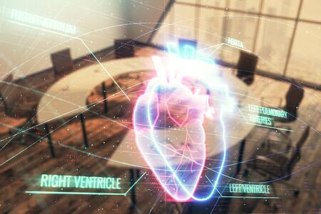 Double exposure of heart hologram on conference room background. Concept of medical educationの写真素材