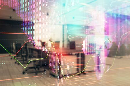 Stock and bond market graph and world map with trading desk bank office interior on background. Multi exposure. Concept of international financeの写真素材