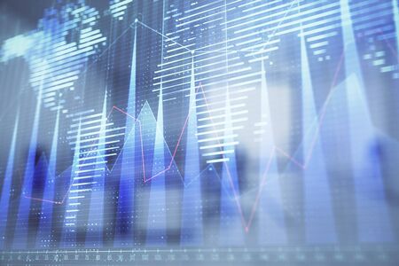 Stock and bond market graph and world map with trading desk bank office interior on background. Multi exposure. Concept of international financeの写真素材