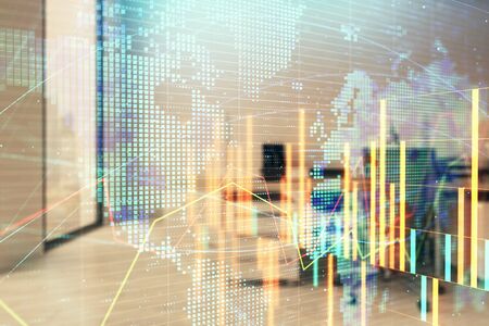 Stock and bond market graph and world map with trading desk bank office interior on background. Multi exposure. Concept of international financeの写真素材
