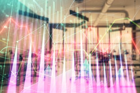 Stock and bond market graph with trading desk bank office interior on background. Multi exposure. Concept of financial analysisの写真素材