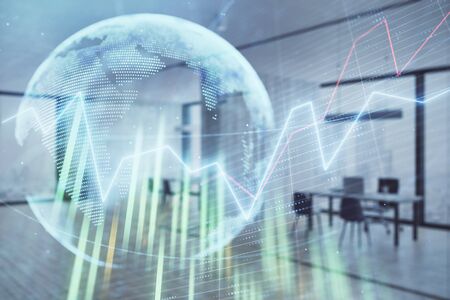 Stock and bond market graph and world map with trading desk bank office interior on background. Multi exposure. Concept of international financeの写真素材