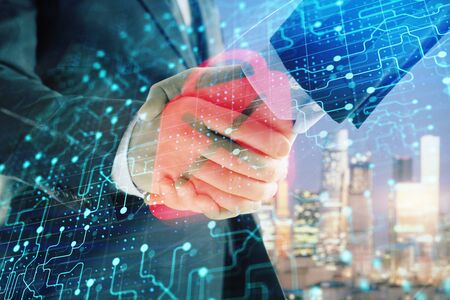 Double exposure of lock icon hologram on city view background with two people handshake. Concept of safe businessの写真素材