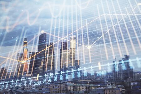 Multi exposure of financial chart on Moscow city downtown background. Concept of stock market analysisの写真素材