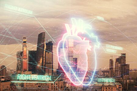 Multi exposure of human heart hologram on Moscow cityscape background. Concept of medical educationの写真素材