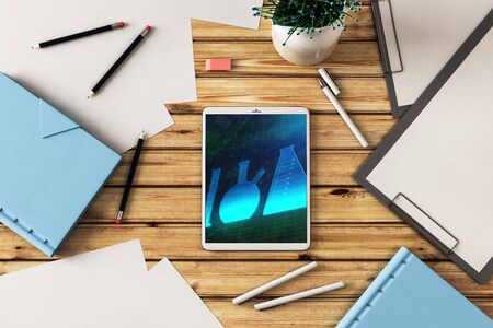 Digital tablet closeup top view with flasks pic on screen. Education concept. 3d rendering.の写真素材