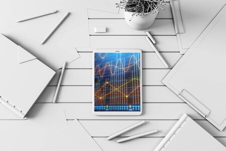 Digital tablet closeup top view with financial graph on screen. Online trading application concept. 3d rendering.の写真素材