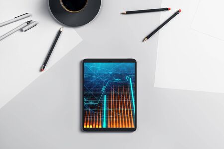 Digital tablet closeup top view with financial graph on screen. Online trading application concept. 3d rendering.の写真素材