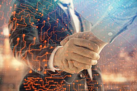 Double exposure of abstract technology drawing on cityscape background with two businessmen handshake. Concept of tech role in businessの写真素材