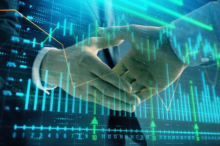 Multi exposure of forex graph on abstract background with two businessmen handshake. Concept of...