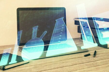 Laboratory flasks sketch hologram with desktop office background. Double exposure. Concept of educationの写真素材
