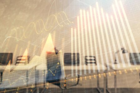 Stock and bond market graph with trading desk bank office interior on background. Multi exposure. Concept of financial analysisの写真素材