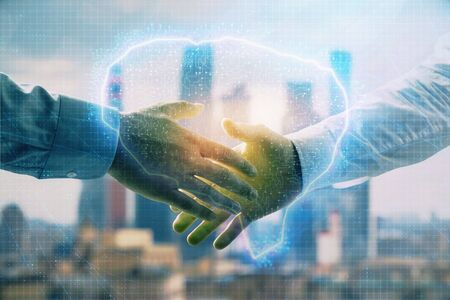 Multi exposure of human brain drawing on city view background with handshake. Concept of brainstormの写真素材