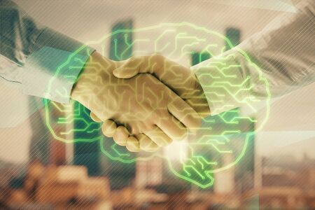 Multi exposure of human brain drawing on city view background with handshake. Concept of brainstorm