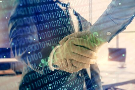 Double exposure of hacking theme hologram on office background with two men handshake. Concept of data securityの写真素材
