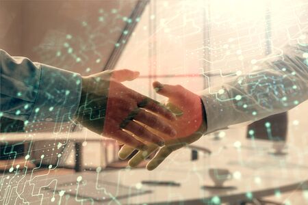 Double exposure of lock icon hologram on office background with two men handshake. Concept of data...
