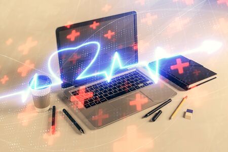 Heart hologram with desktop office background. Double exposure. Concept of medical educationの写真素材
